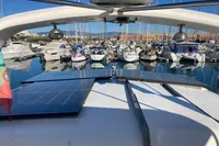 Trader 47 yacht with solar panels docked in a marina, 1991 model.