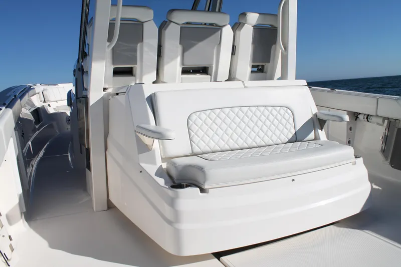  Yacht Photos Pics 2023 Pursuit S 378 Sport boat interior with white cushioned seating.
