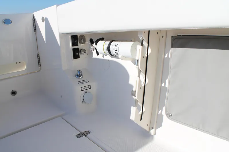  Yacht Photos Pics 2023 Pursuit S 378 Sport boat interior with utility panel and storage compartment.