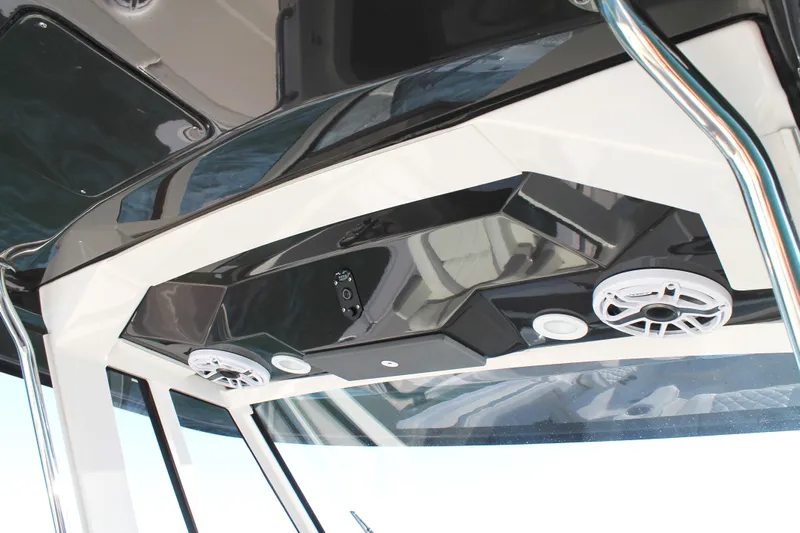  Yacht Photos Pics 2023 Pursuit S 378 Sport boat interior with speakers and sleek design.