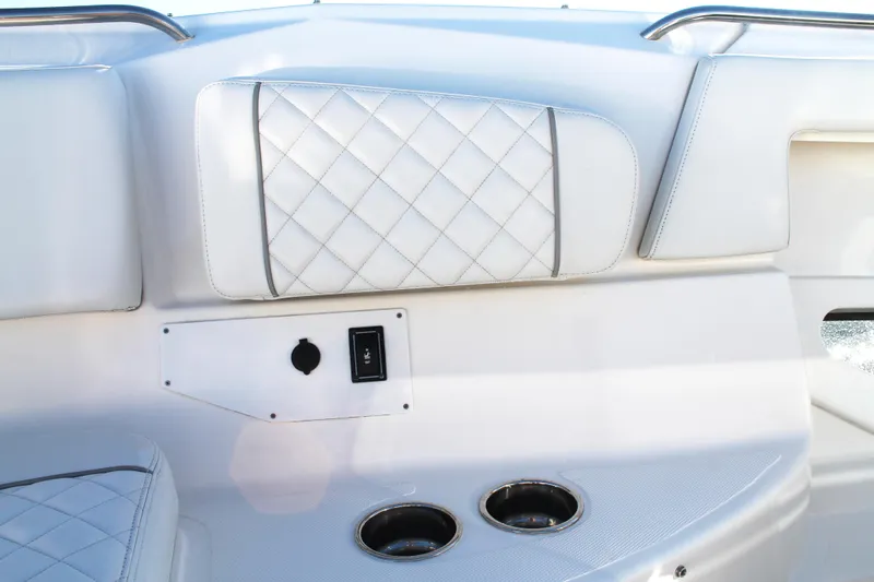  Yacht Photos Pics 2023 Pursuit S 378 Sport boat interior with quilted upholstery and cup holders.