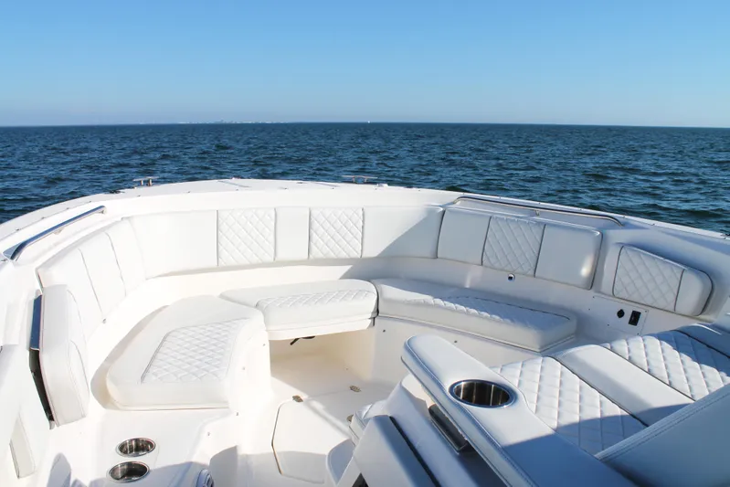  Yacht Photos Pics 2023 Pursuit S 378 Sport boat with luxurious seating on open water.