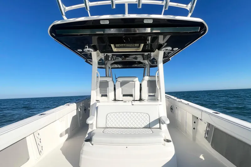  Yacht Photos Pics 2023 Pursuit S 378 Sport boat on open water under clear blue sky.