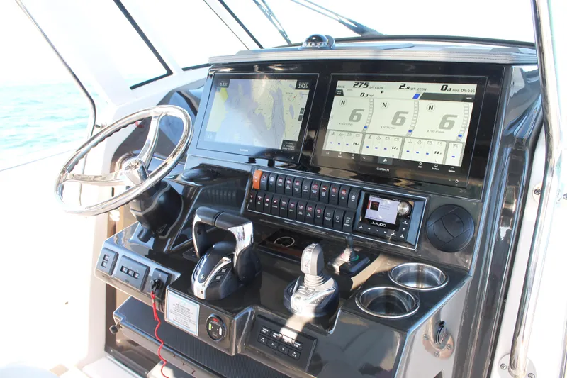  Yacht Photos Pics 2023 Pursuit S 378 Sport boat dashboard with advanced navigation and control systems.