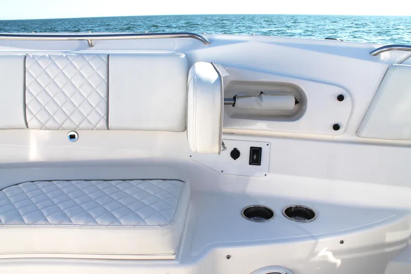  Yacht Photos Pics Luxurious seating on 2023 Pursuit S 378 Sport boat with ocean backdrop.