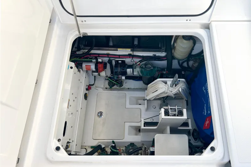 Yacht Photos Pics 2023 Pursuit S 378 Sport boat engine compartment with equipment and storage.