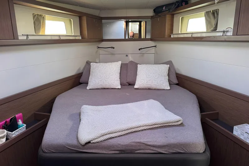  Yacht Photos Pics Luxurious cabin interior of 2017 Beneteau Sense 51 yacht with cozy bedding.