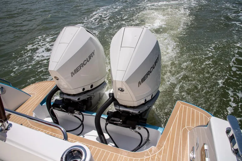 In Stock Yacht Photos Pics Twin Mercury outboard engines on 2025 MJM 35 boat, cruising on water.