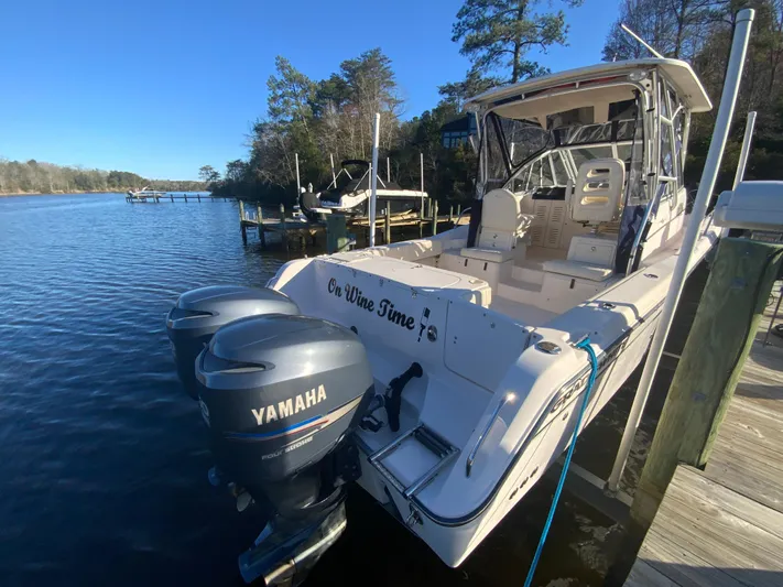 On Wine Time Yacht Photos Pics 2009 Grady-White Chesapeake 290 boat docked with Yamaha engines, clear blue sky.