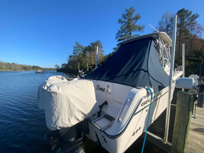 On Wine Time Yacht Photos Pics 2009 Grady-White Chesapeake 290 boat docked on a sunny day by the water.