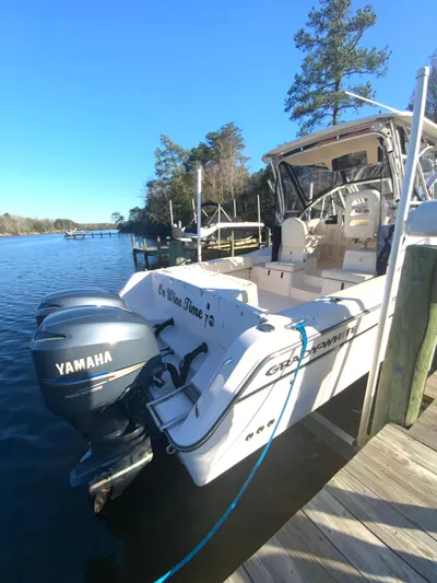 On Wine Time Yacht Photos Pics 2009 Grady-White Chesapeake 290 boat docked with Yamaha engines, scenic water view.