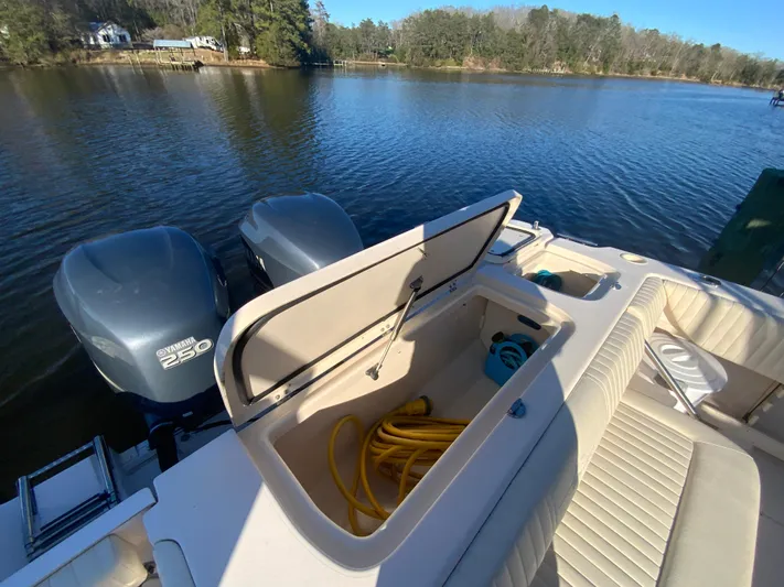 On Wine Time Yacht Photos Pics 2009 Grady-White Chesapeake 290 boat with Yamaha 250 engines on a serene lake.