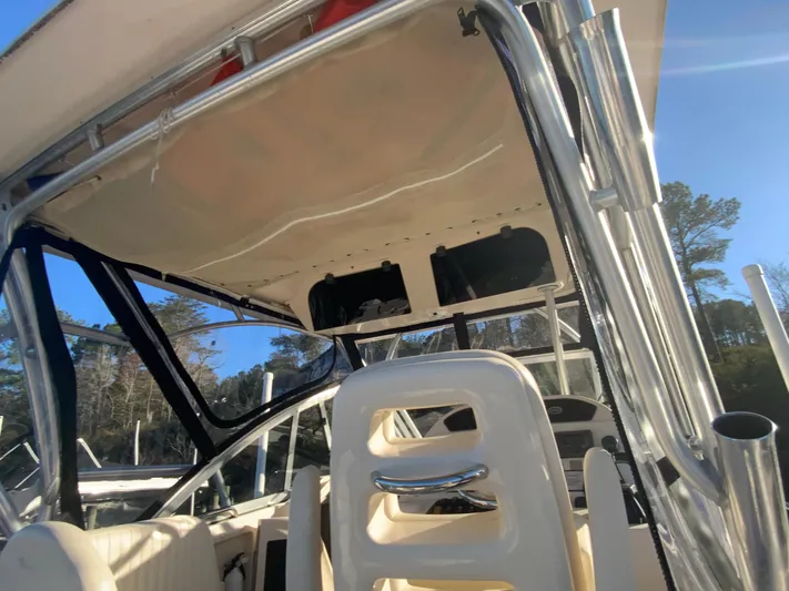 On Wine Time Yacht Photos Pics 2009 Grady-White Chesapeake 290 boat interior with seating and canopy structure.