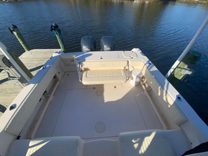 On Wine Time Yacht Photos Pics 2009 Grady-White Chesapeake 290 boat docked, featuring spacious deck and twin engines.