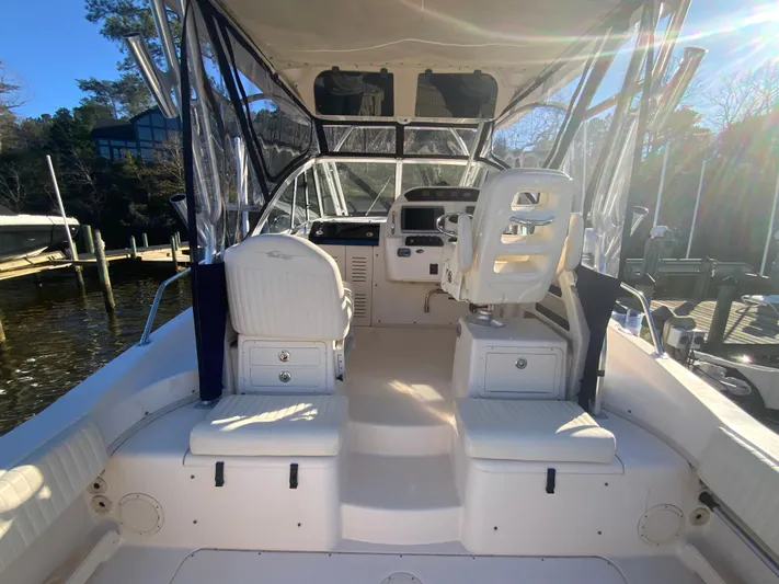 On Wine Time Yacht Photos Pics 2009 Grady-White Chesapeake 290 boat interior with helm and seating.