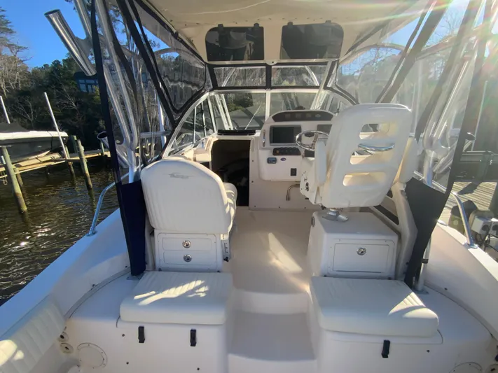 On Wine Time Yacht Photos Pics 2009 Grady-White Chesapeake 290 boat interior with helm and seating area.