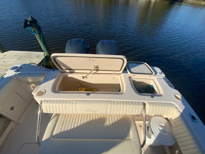 On Wine Time Yacht Photos Pics 2009 Grady-White Chesapeake 290 boat with open storage compartments on a sunny day.