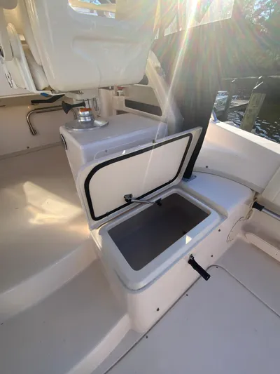 On Wine Time Yacht Photos Pics 2009 Grady-White Chesapeake 290 boat interior with open storage compartment.