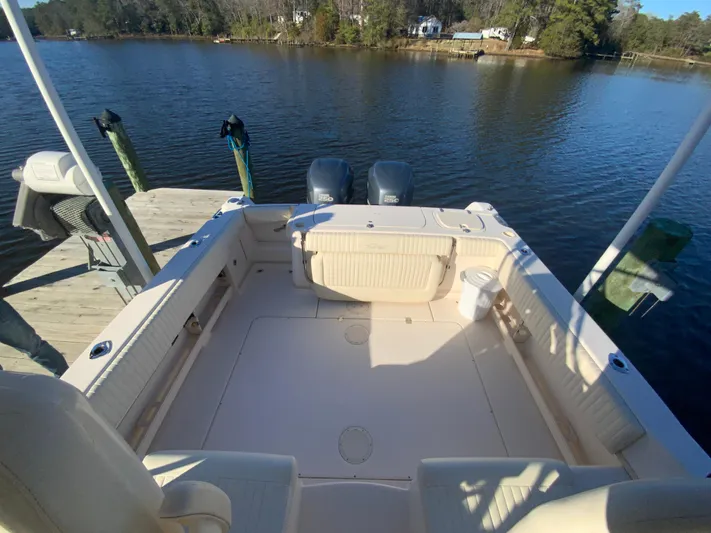 On Wine Time Yacht Photos Pics 2009 Grady-White Chesapeake 290 boat docked on a serene lake with twin engines.