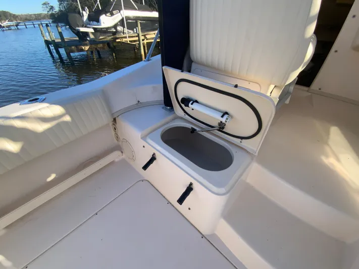 On Wine Time Yacht Photos Pics 2009 Grady-White Chesapeake 290 boat interior with open storage compartment.