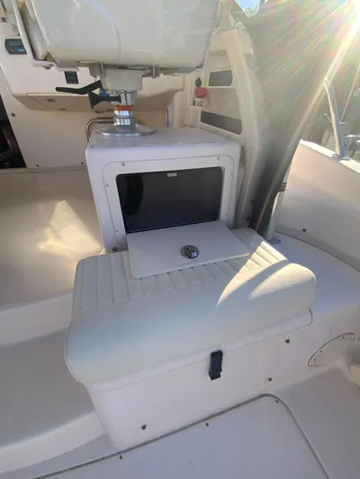 On Wine Time Yacht Photos Pics 2009 Grady-White Chesapeake 290 boat interior with seating and storage compartment.
