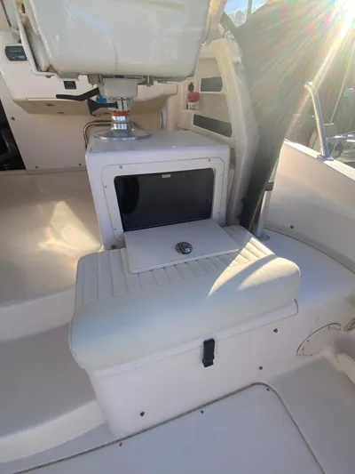 On Wine Time Yacht Photos Pics 2009 Grady-White Chesapeake 290 boat interior with seating and storage compartment.