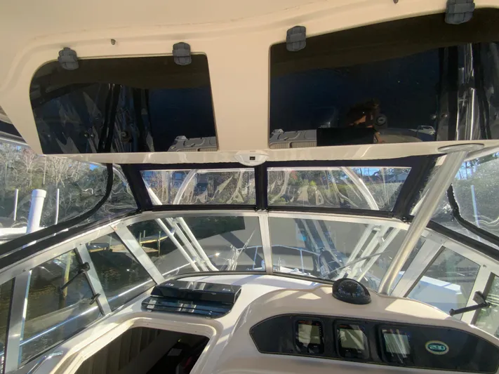 On Wine Time Yacht Photos Pics 2009 Grady-White Chesapeake 290 boat interior with clear windows and dashboard view.