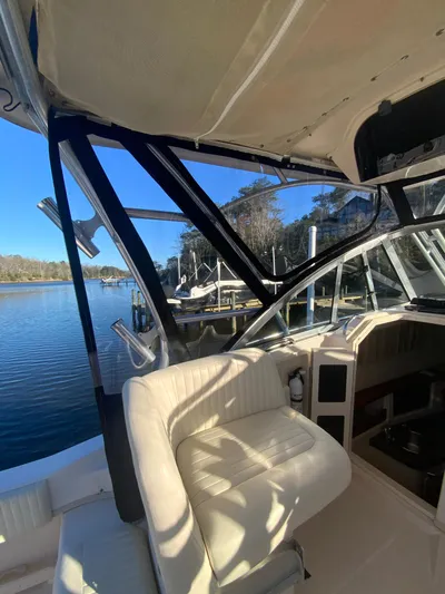 On Wine Time Yacht Photos Pics 2009 Grady-White Chesapeake 290 boat interior with white seating and scenic water view.