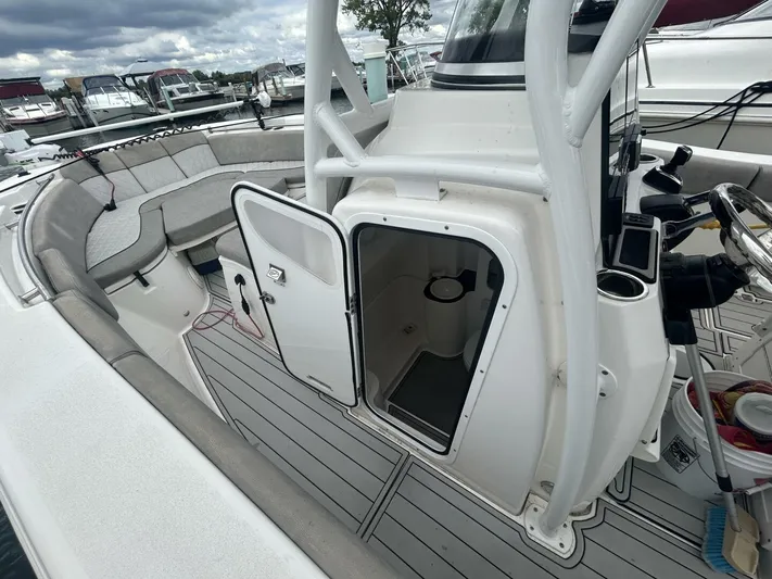  Yacht Photos Pics 2018 Sea Fox 288 Commander boat interior with open storage compartment and seating area.