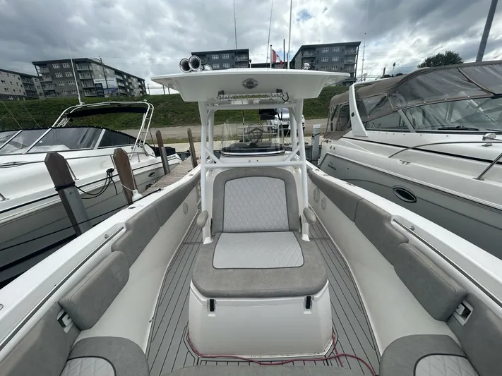  Yacht Photos Pics 2018 Sea Fox 288 Commander boat interior at marina, featuring seating and helm station.