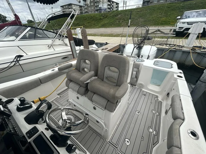  Yacht Photos Pics 2018 Sea Fox 288 Commander boat interior with dual seats and steering wheel at dock.