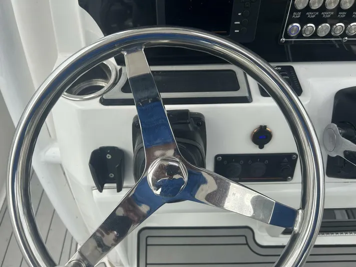  Yacht Photos Pics Steering wheel of a 2018 Sea Fox 288 Commander boat cockpit.