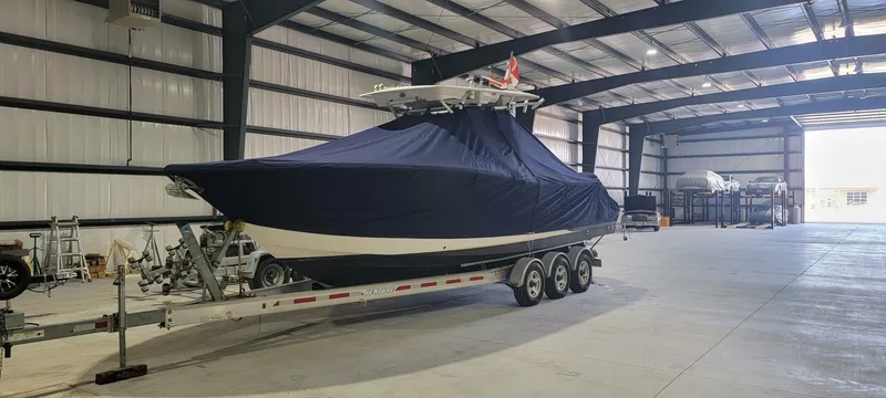  Yacht Photos Pics 2018 Sea Fox 288 Commander boat covered in a warehouse on a trailer.