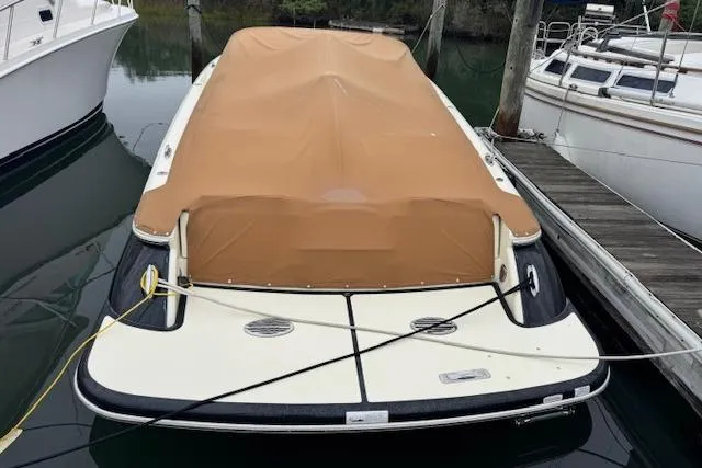 Snippy Yacht Photos Pics 2019 Chris-Craft Launch 30 boat with tan cover docked at marina.