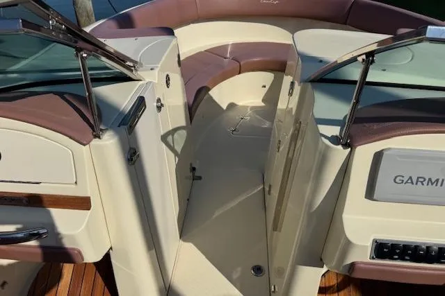 Snippy Yacht Photos Pics 2019 Chris-Craft Launch 30 boat interior with seating and Garmin navigation system.
