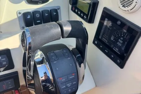Snippy Yacht Photos Pics 2019 Chris-Craft Launch 30 dashboard with throttle controls and digital display.
