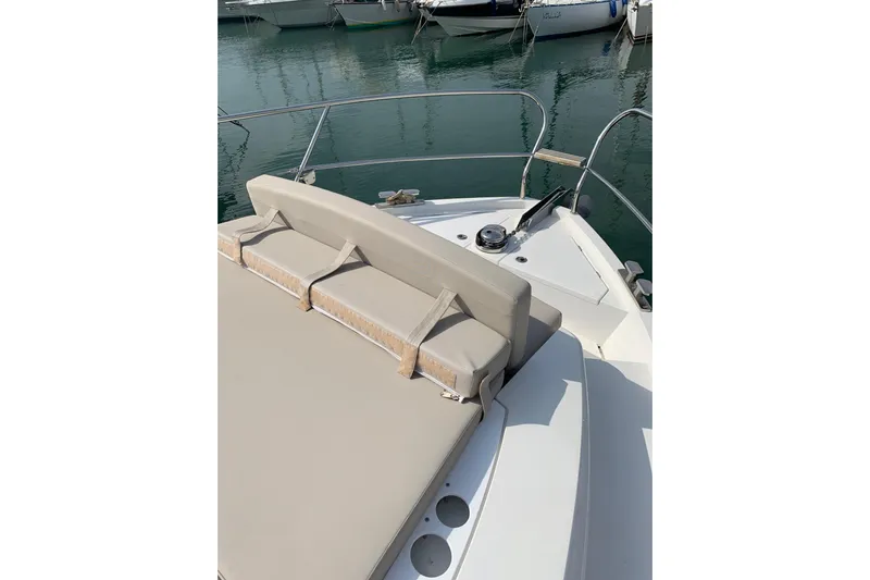  Yacht Photos Pics 2016 Sealine C330 boat with beige seating, docked in a marina.