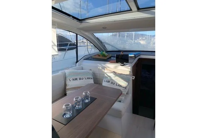  Yacht Photos Pics Interior of 2016 Sealine C330 yacht with cozy seating and nautical decor.