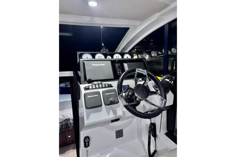 Yacht Photos Pics Helm of 2016 Sealine C330 yacht with Raymarine navigation system and modern controls.
