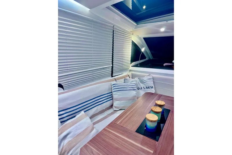  Yacht Photos Pics Interior of 2016 Sealine C330 yacht with cozy seating and decorative pillows.