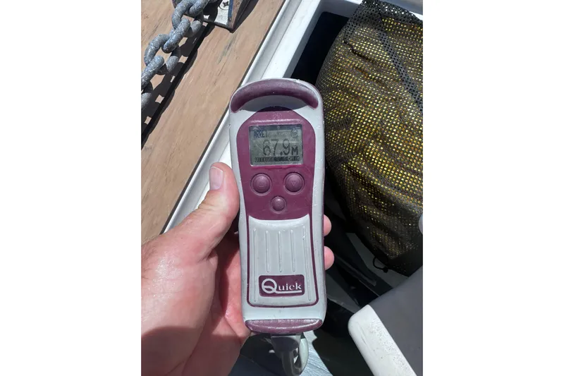  Yacht Photos Pics Hand holding a Quick windlass remote on a 2016 Sealine C330 boat.