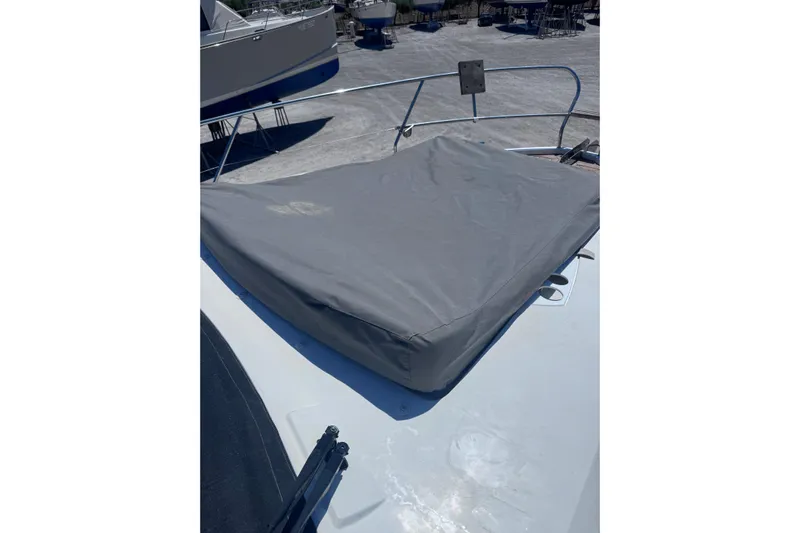  Yacht Photos Pics 2016 Sealine C330 boat with covered deck area, docked outdoors.