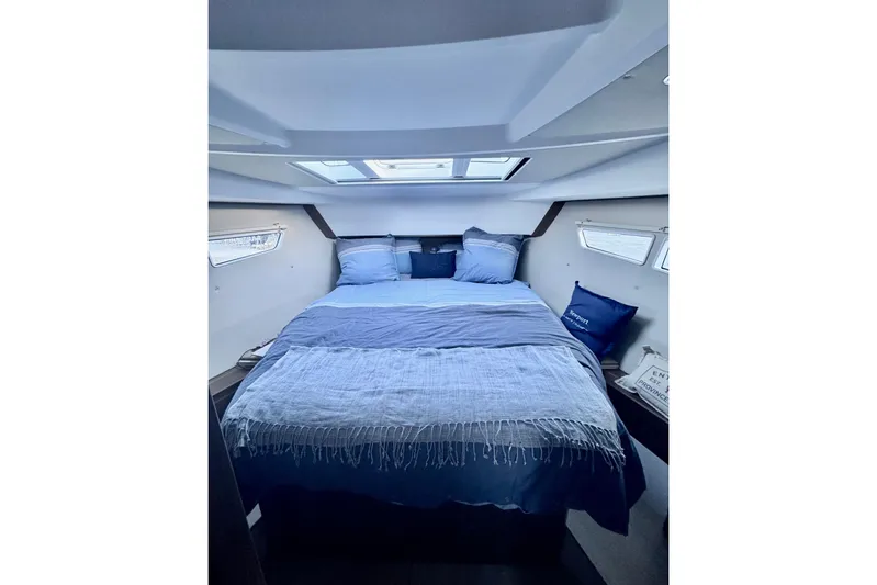  Yacht Photos Pics Luxurious cabin interior of 2016 Sealine C330 yacht with skylight and cozy bedding.