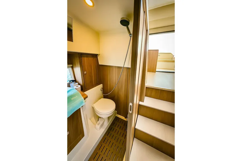  Yacht Photos Pics 2016 Sealine C330 yacht bathroom with wooden interior and compact design.