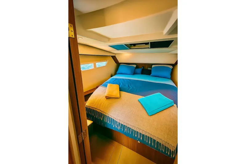  Yacht Photos Pics Luxurious cabin interior of 2016 Sealine C330 yacht with cozy bedding and window view.