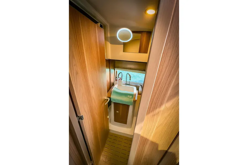  Yacht Photos Pics 2016 Sealine C330 yacht bathroom with wooden interior and modern sink.
