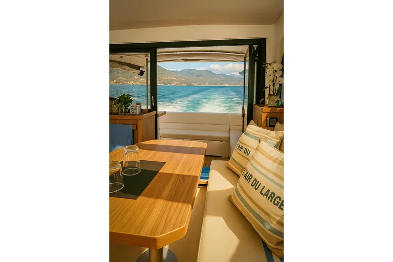  Yacht Photos Pics Interior of 2016 Sealine C330 yacht with scenic ocean view through open doors.