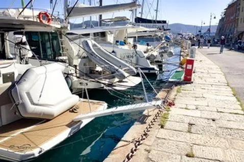  Yacht Photos Pics 2016 Sealine C330 yacht docked at a sunny marina with clear blue water.