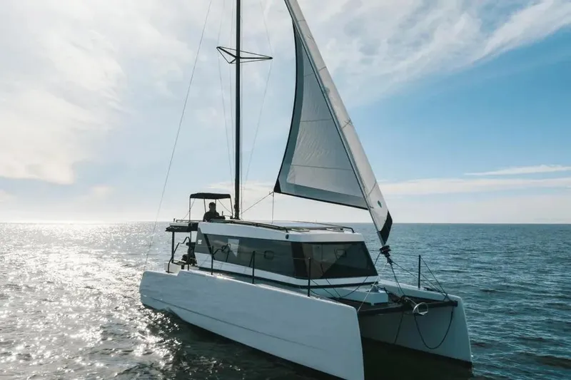 Sol Provider Yacht Photos Pics 2023 Hop Yacht 30 sailing on open sea under clear blue sky.