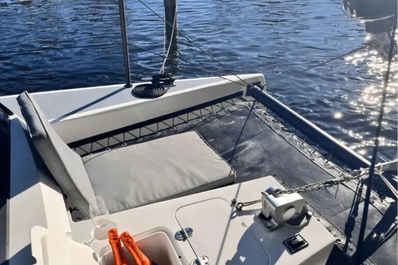 Sol Provider Yacht Photos Pics 2023 Hop Yacht 30 deck with seating, winch, and water reflections.